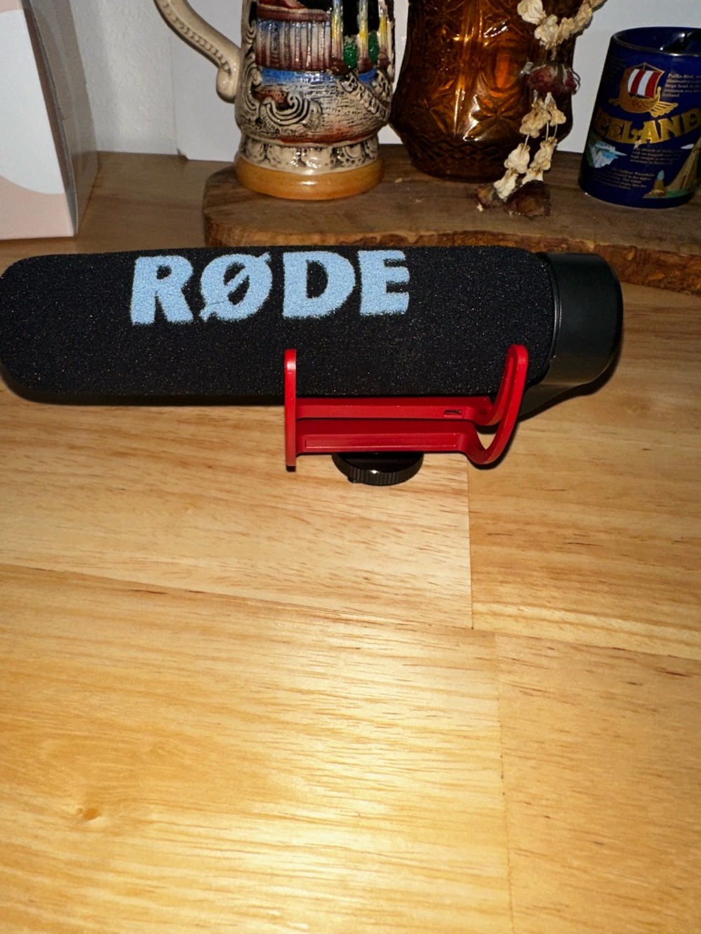 Black Shotgun Microphone with Red Shock Mount